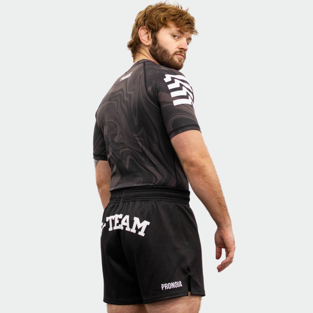 BTEAM X PRONOIA RASH GUARD BLACK(SIZING RUNS SMALL)