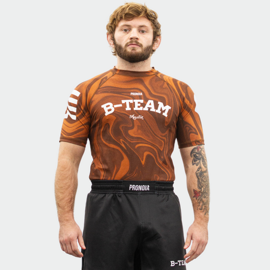 BTEAM X PRONOIA RASH GUARD BROWN(SIZING RUNS SMALL)