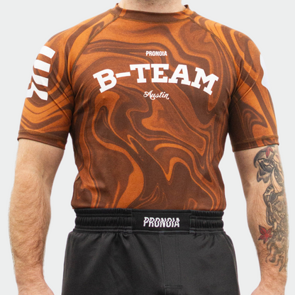 BTEAM X PRONOIA RASH GUARD BROWN(SIZING RUNS SMALL)