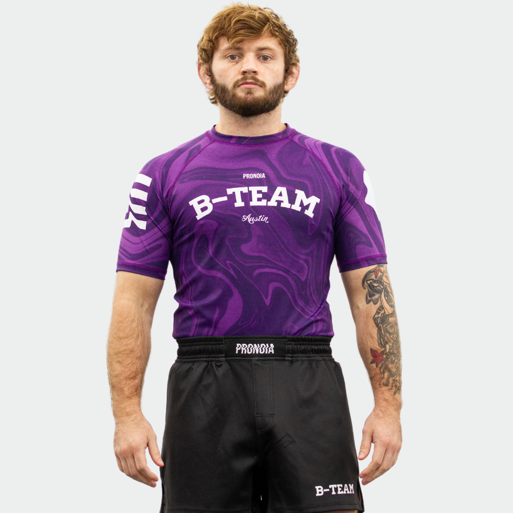 BTEAM X PRONOIA RASH GUARD PURPLE(SIZING RUNS SMALL)