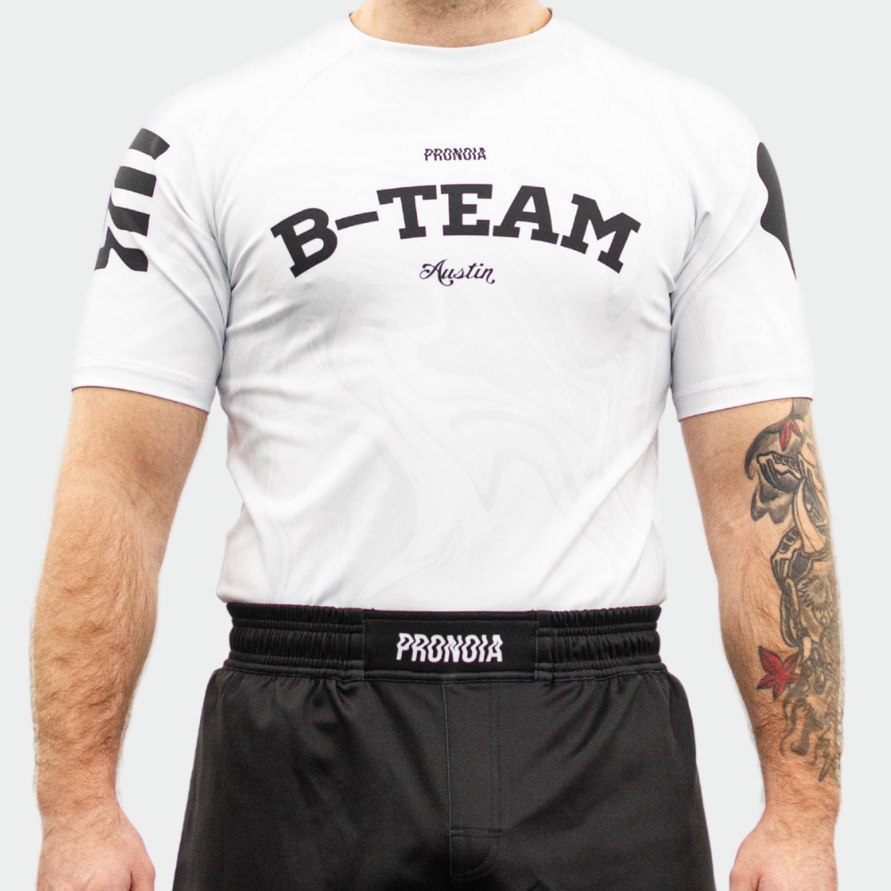 BTEAM X PRONOIA RASH GUARD WHITE (SIZING RUNS SMALL)